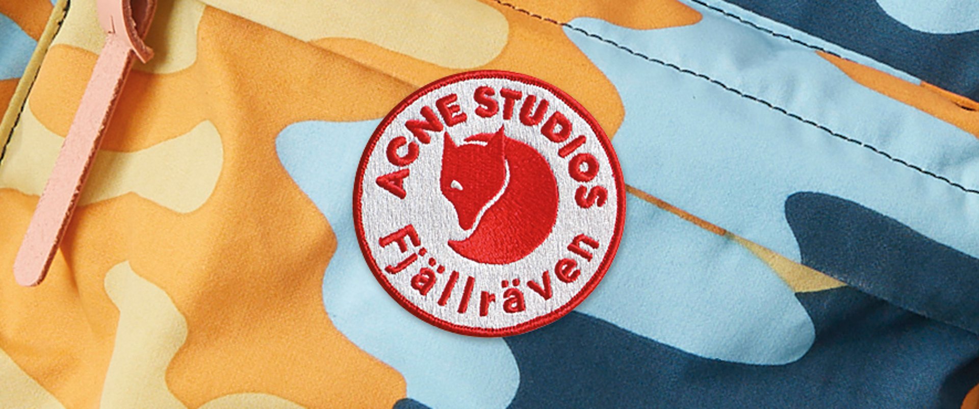 Closeup of Acne Studios and Fjallraven cobranded logo